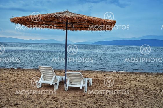 Beach, umbrella, chairs, lake