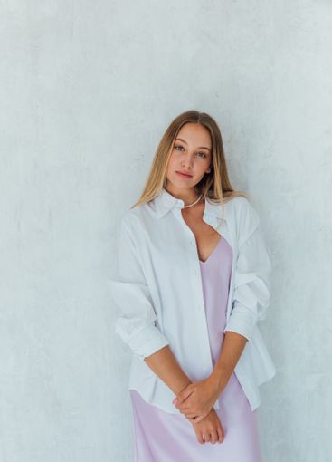 Beautiful slim fashion blonde woman in summer silk dress