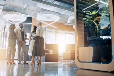 Lobby, pod and business people in office talking for...
