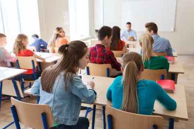 group of students writing school test
