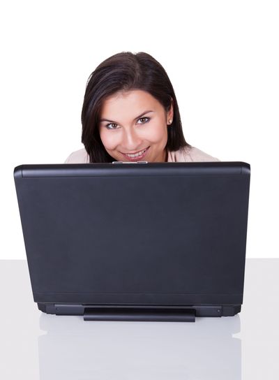 Woman sitting working at her laptop