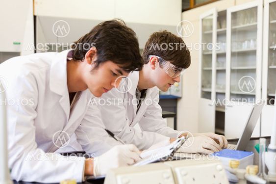 Chemistry students writing a report
