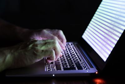Hand Of A Person Typing On Laptop