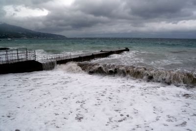 View of storm seascape. Dark moody sky over the gray...