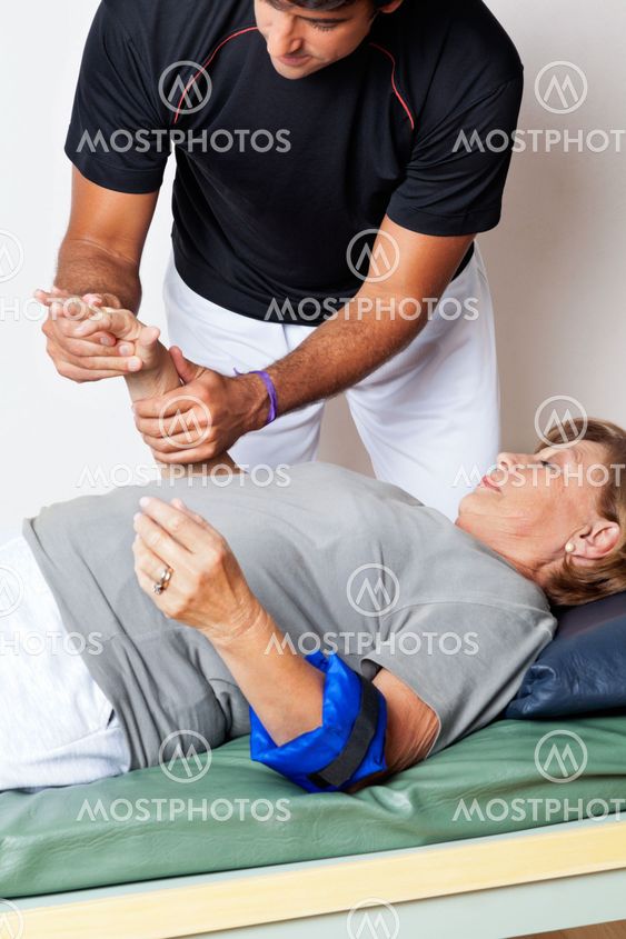 Therapist Examining Woman's Hand