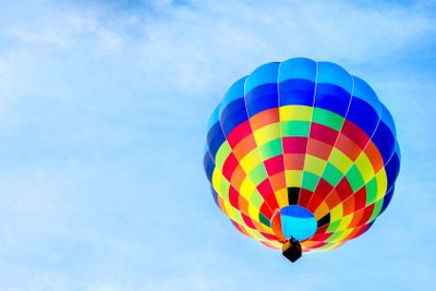 sinlge hot air balloon colorful blue sky background fly