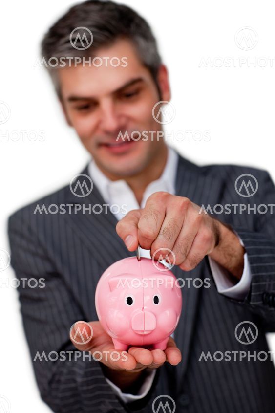 Sophisticated male executive saving money in a piggybank
