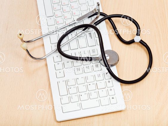 phonendoscope on white keyboard