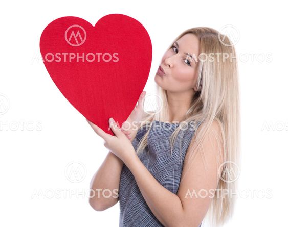 Isolated happy young blond caucasian woman holding big...