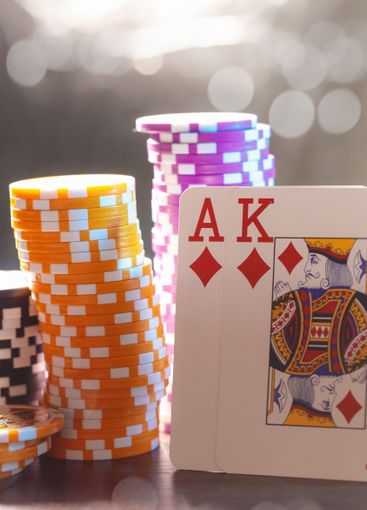 Poker game set of cards and chips close up