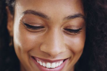 Face, beauty and happy woman in closeup on studio...