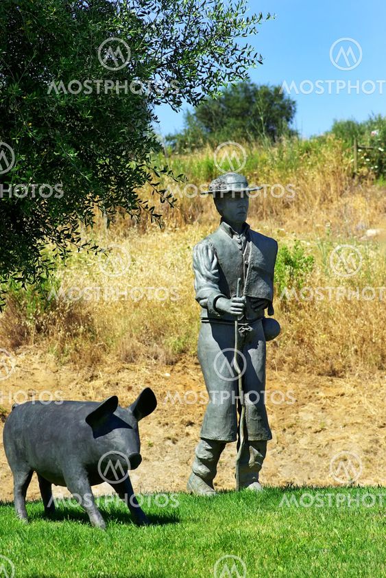 Man and pig statue , Arronches village, Portugal.