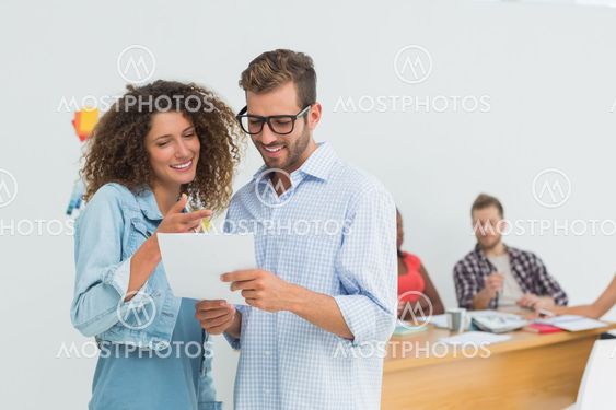 Attractive designers looking at tablet pc