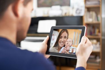 Parents, screen and baby on tablet for video call,...
