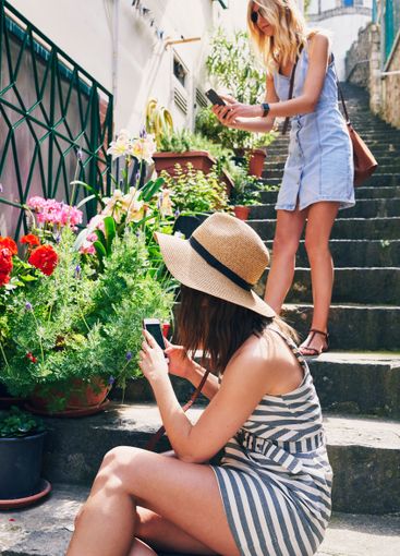 Women, phone and photography for flowers, tourism or...
