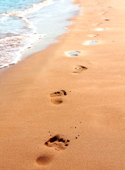 footprints on sand beach