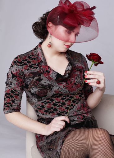 Pretty brunette woman in red hat retro style fashion...
