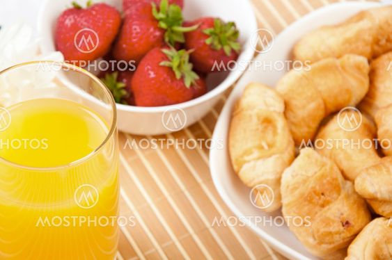 Breakfast with berries,orange juice and croissant