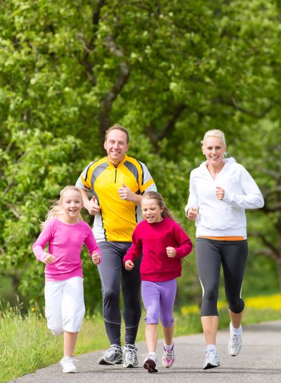Family jogging for sport outdoors