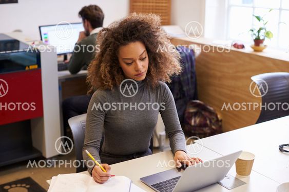 Staff In Design Office With CAD System For Laser Cutter