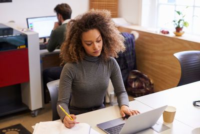 Staff In Design Office With CAD System For Laser Cutter