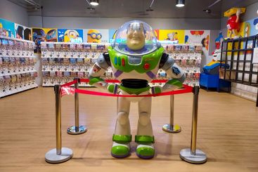 Buzz Lightyear dolls displayed in a gashapon toy store