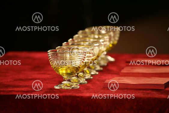 set of glass bowls of red liquid on the table
