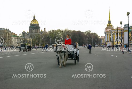 ST. PETERSBURG, RUSSIA - JANUARY 01, 2008: Carriage with horses on the Palace Square view to the Kazan Cathedral of Our Lady ,