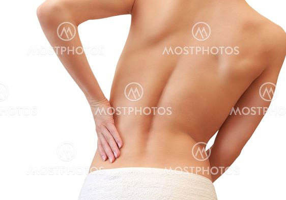 Beautiful woman holding her back in sport pain isolated...