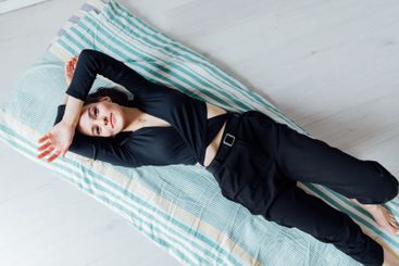 Beautiful fashionable brunette woman lying on sleeping...