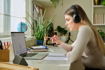 Young woman using typing working studying on laptop,...