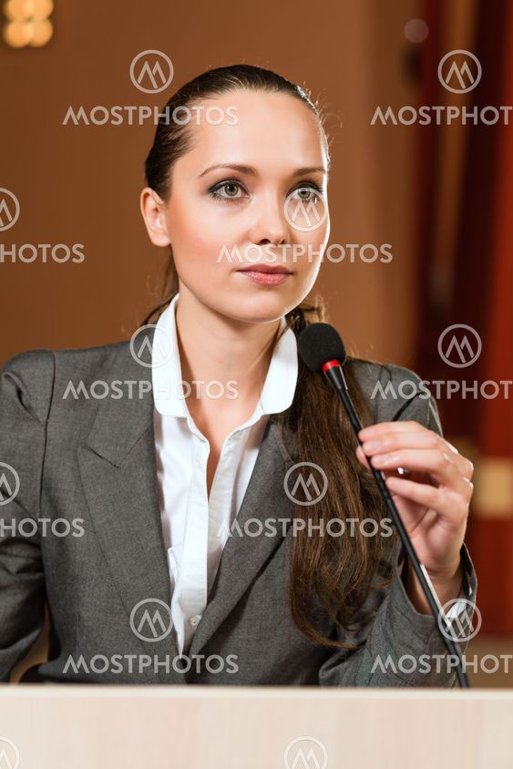 Portrait of a business woman with microphone