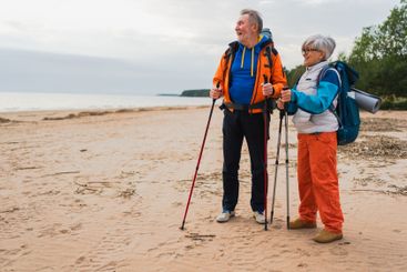Hiking tourism adventure. Senior couple man woman...