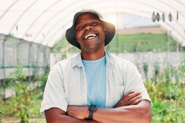 Laugh, greenhouse and portrait of black man on farm with...
