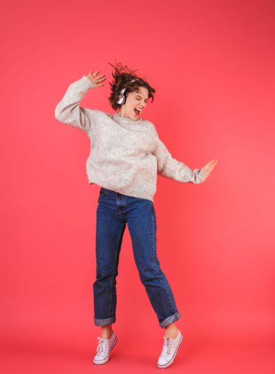 Full length portrait of a happy young woman