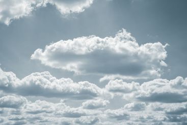 Dramatic overcast sky with gray clouds forming moody and...