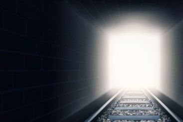 Out of the darkness and into the light. A shot of train...