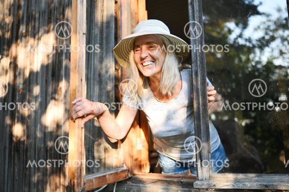 Happy smiling emotional elderly woman having fun posing...