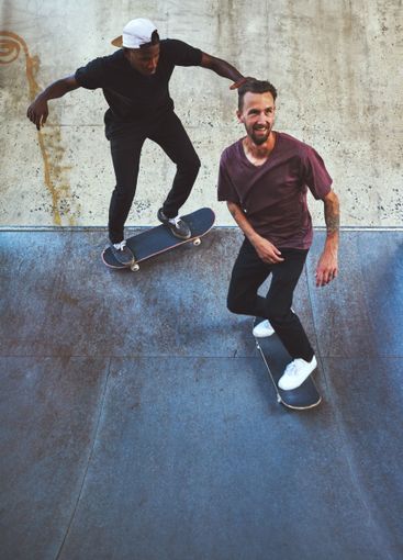 Culture, skateboard and ramp with friends at park for...