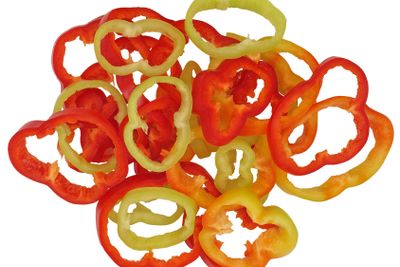 Sliced multicoloured pepper.Isolated