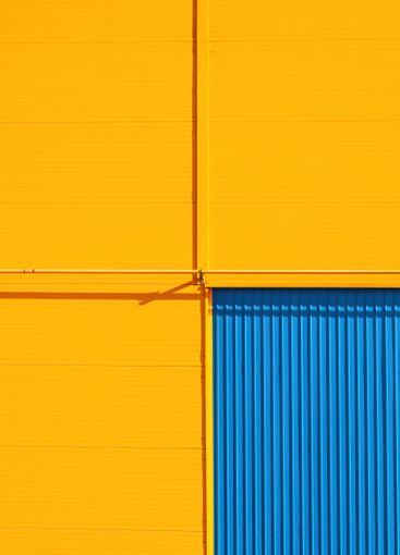 Detail of an industrial warehouse building with yellow...
