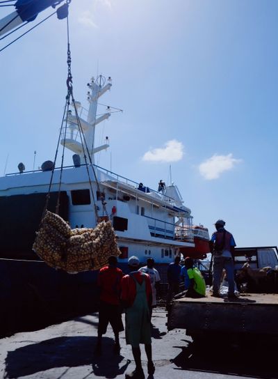 sailors waiting to off load the goods in the beautiful...