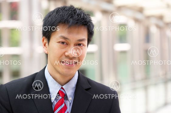 Portrait Of Chinese Businessman Outside Office