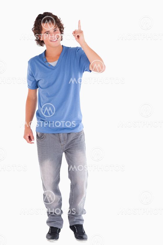 Cute guy pointing at copyspace
