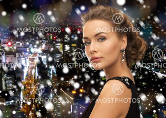 beautiful woman in evening dress wearing earrings