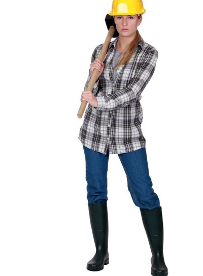 Moody labourer carrying a mallet