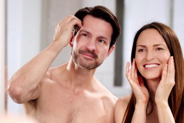 Young couple practicing daily skin care routine together