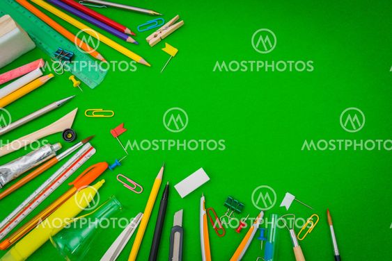 School supplies on Green chalkboard " Back to school...