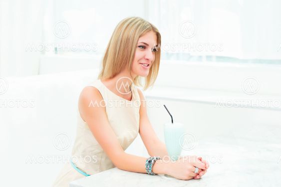 portrait of a beautiful woman in the cafe