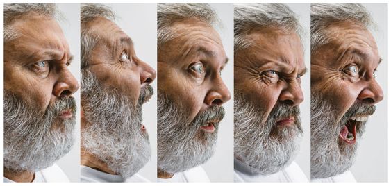 The senior attractive man looking suprised isolated on...